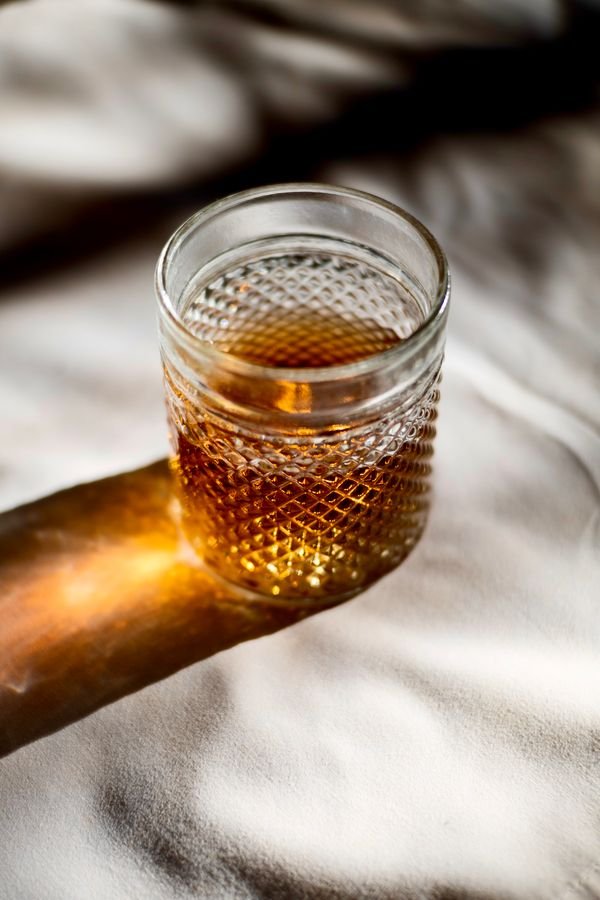 Instagram post: glass of whisky in warm evening light