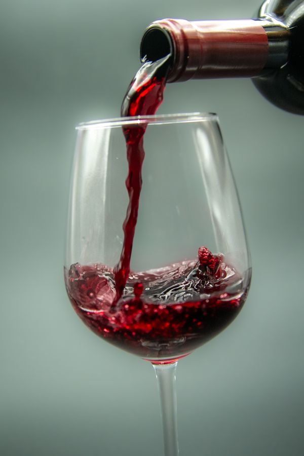 Instagram post: red wine being poured into a glass